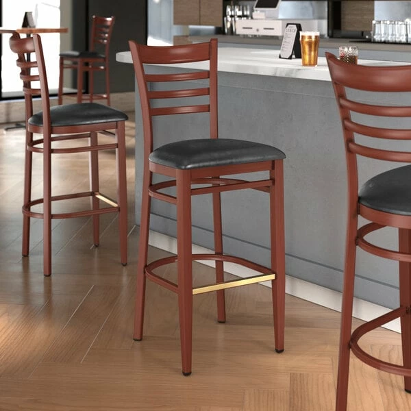 LT&S Spartan Series Lancaster Table & Seating Spartan Series Bar Height Metal Ladder Back Chair With Mahogany Wood Grain Finish And Black Vinyl Seat 1 LT&S Spartan Series Lancaster Table & Seating Spartan Series Bar Height Metal Ladder Back Chair With Mahogany Wood Grain Finish And Black Vinyl Seat