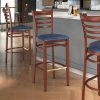 LT&S Spartan Series Lancaster Table & Seating Spartan Series Bar Height Metal Ladder Back Chair With Mahogany Wood Grain Finish And Navy Vinyl Seat
