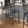 LT&S Spartan Series Lancaster Table & Seating Spartan Series Bar Height Metal Ladder Back Chair With Walnut Wood Grain Finish And Navy Vinyl Seat
