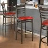LT&S Spartan Series Lancaster Table & Seating Spartan Series Bar Height Metal Ladder Back Chair With Walnut Wood Grain Finish And Red Vinyl Seat