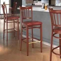 LT&S Spartan Series Lancaster Table & Seating Spartan Series Bar Height Metal Slat Back Chair With Mahogany Wood Grain Finish And Burgundy Vinyl Seat