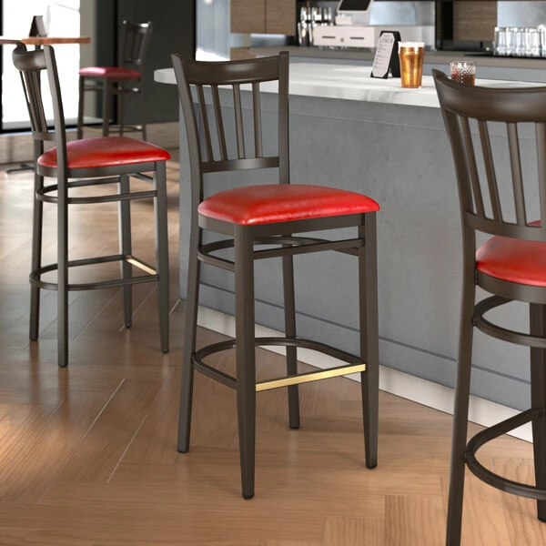 LT&S Spartan Series Lancaster Table & Seating Spartan Series Bar Height Metal Slat Back Chair With Walnut Wood Grain Finish And Red Vinyl Seat 1 LT&S Spartan Series Lancaster Table & Seating Spartan Series Bar Height Metal Slat Back Chair With Walnut Wood Grain Finish And Red Vinyl Seat