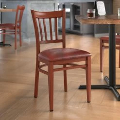 LT&S Spartan Series Lancaster Table & Seating Spartan Series Metal Slat Back Chair With Mahogany Wood Grain Finish And Burgundy Vinyl Seat